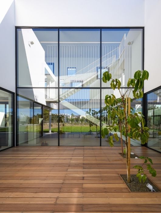 six pane silicone bonded double height glass wall six pane silicone bonded double height glass wall
