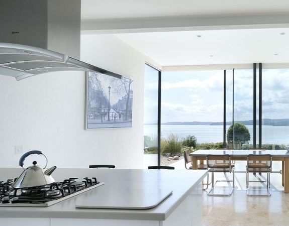 slim framed sliding glass doors with a beautiful sea view