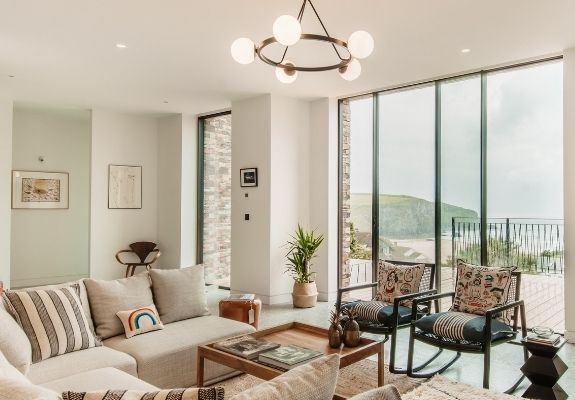 tall ultra slim sliding doors on a luxury coastal home providing an uninterrupted sea view tall ultra slim sliding doors on a luxury coastal home providing an uninterrupted sea view