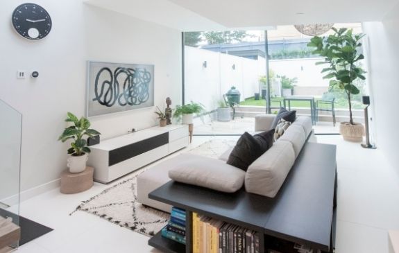 Cropley street double height extension with floor to ceiling slim sliding glass doors and house plants for a Scandinavian architecture style and minimal interior deisng