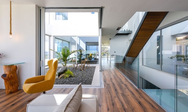 internal courtyard surrounded by slim sliding glass doors with aluminium frames and internal frameless glass balustrades internal courtyard surrounded by slim sliding glass doors with aluminium frames and internal frameless glass balustrades