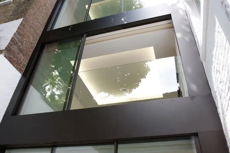 contemporary Juliet balcony design with a frameless glass balustrade and slim sliding door contemporary Juliet balcony design with a frameless glass balustrade and slim sliding door