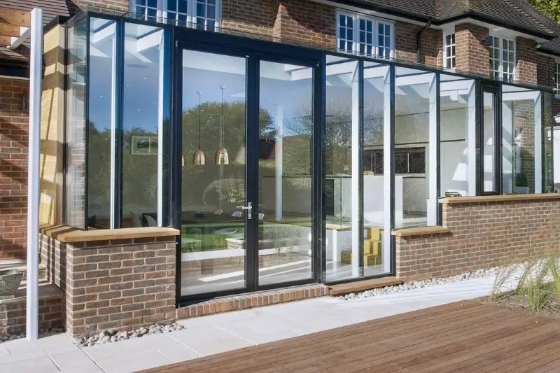 double opening aluminium casement patio doors from Schuco used in a glass extension